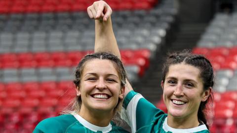 Amee-Leigh Murphy Crowe (right) congratulates player of the match Erin King