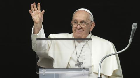 Pope Francis waving at crowds