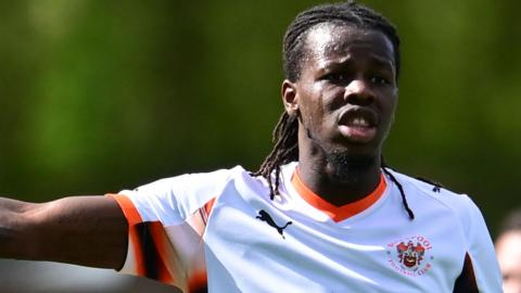 Karoy Anderson in a white Blackpool shirt