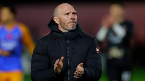 Shrewsbury Town manager Michael Appleton applauds supporters after a match