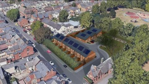 An artist impression aerial view of new homes on a green space in Derby