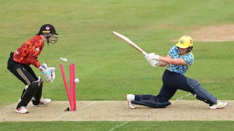 Charis Pavely is bowled after top scoring for Warwickshire Bears