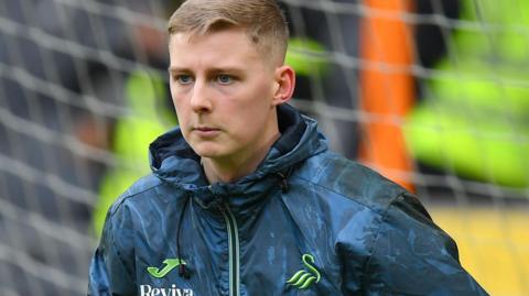 Nathan Broome warming up for Swansea City