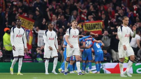 Tottenham players looking dejected as Atletico Madrid players celebrate in the background