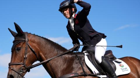 Ros Canter, riding Lordships Graffalo, punches the air