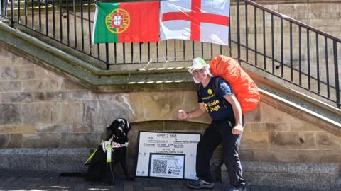 A picture of Ian ahead of his walk alongside a guide dog from the charity