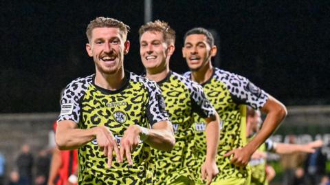 Tom Knowles celebrates scoring for Forest Green at Morecambe