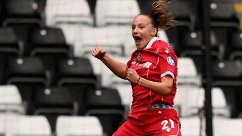 Lili Mai Jones of Wrexham celebrates scoring her side's third goal at Swansea