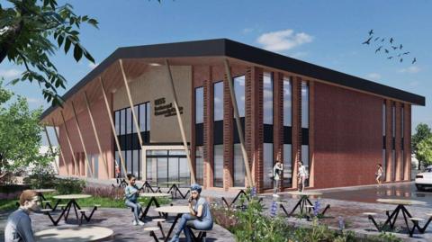 A computer generated version of how the new building might look. It is a two storey building large, high-windows. Out the front are tables and stools with some CGI people sitting on them.