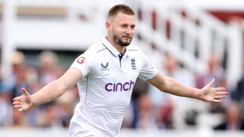 Gus Atkinson celebrates taking the wicket of Joshua da Silva of West Indies