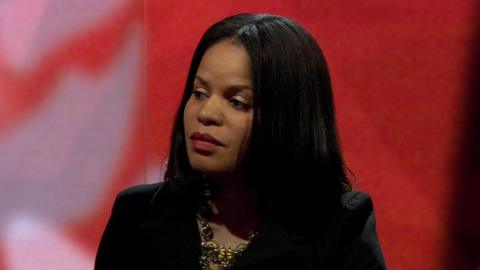 Head and shoulders view of politician Claudia Webbe on a red background while appearing on Newsnight