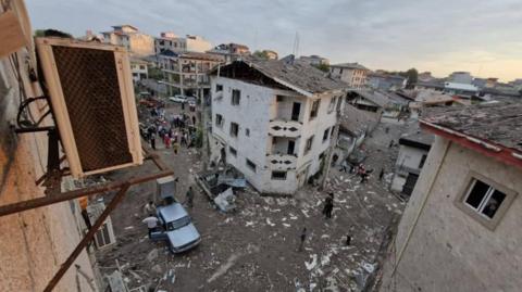 Photo received by BBC Persian said to show damaged buildings in Astaneh-ye Ashrafiyeh, Gilan province, Iran, following an air strike that killed a nuclear scientist (24 June 2025)