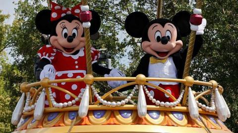 Mickey Mouse and Minnie Mouse  on a float during the daily Festival of Fantasy Parade at Walt Disney World on 3 April, 2025, in Orlando, Florida.