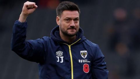 Johnnie Jackson raises his fist in celebration