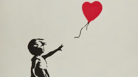 Banksy's Girl With Ballon print. A stencil of a girl letting go of a red heart-shaped baloon.