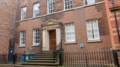 Maister House - a historic Georgian-style brick building with a grand stone portico entrance and symmetrical sash windows.