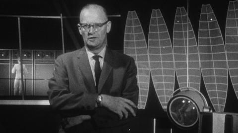 Arthur C Clarke in front of futuristic set