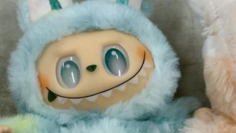 A sky blue labubu toy