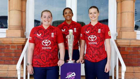 Sophie Ecclestone, Sophia Dunkley and Lauren Bell pose with T20 World Cup trophy at launch event