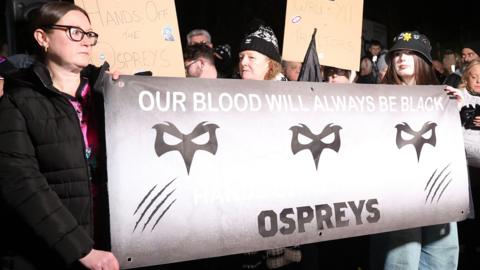 Ospreys fans have protested against the proposed bid by their owners to buy Cardiff from the Welsh Rugby Union (WRU)