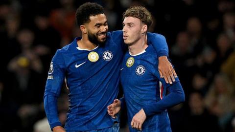 Reece James putting his arm around Cole Palmer