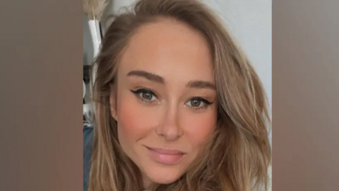 Joanna Derkacz, a woman with long blonde/brown hair, is pictured smiling at the camera. 