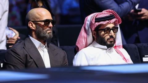 Turki Al-Sheikh watches the boxing with actor Jason Statham