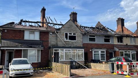 Houses damaged by a fire in Gorleston Road, Highers Heath, in the West Midlands.