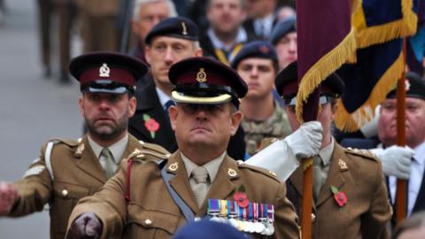 A parade marching in Melton, Leicestershire