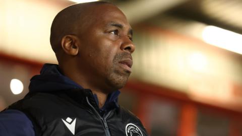 Darren Byfield looks on from the dugout during a Walsall game