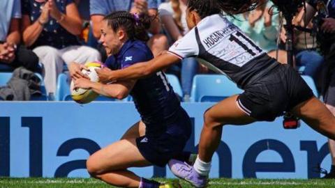 Scotland's Rhona Lloyd scores a try against Canada