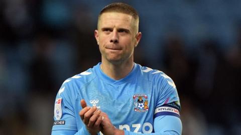 Coventry defender Jake Bidwell claps the fans after the 2-1 win over Watford