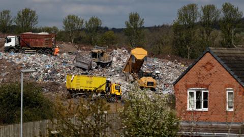 Lorries working on Walleys Quarry near homes