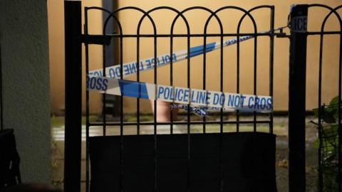 Police tape at the scene in Shirley Road in Stratford, east London, where a man has died after being fatally injured by a dog on the morning of  Wednesday 5 December 2024 