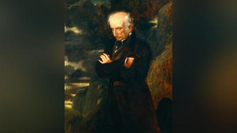 A portrait of Wordsworth on top of Helvellyn painted by Benjamin Robert Haydon. The painting is dominated by dark colours and features the poet in the foreground, with white balding hair, wearing a long black coat, with mountains in the background.
