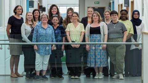 The team of screeners standing for a group picture