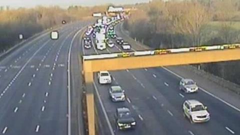 Traffic camera reveals congestion on the northbound M6 in Lancashire. The opposite southbound carriageway, by contrast, is clear.