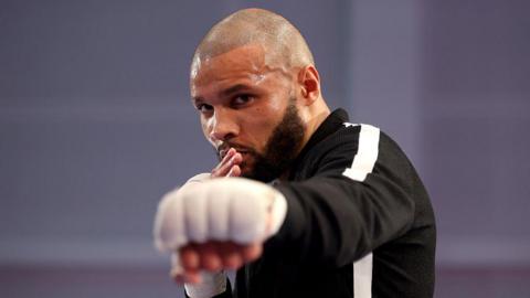 Chris Eubank Jr holds out his fist during an open workout