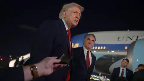 Trump outside Air Force One speaking to reporters