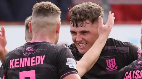 Ethan Devine celebrates scoring for Ballymena