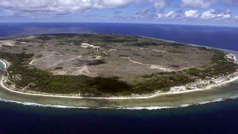Aerial view of Nauru - it's a small island and looks quite barren.
