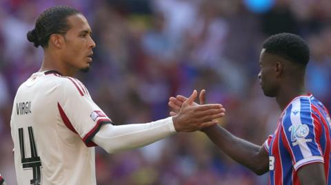 Virgil van Dijk of Liverpool shaking hands with Marc Guehi of Crystal Palace after the Community Shield