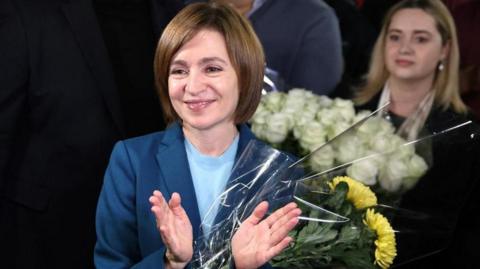 Moldova's incumbent President and presidential candidate Maia Sandu celebrates with her supporters following the announcement of the preliminary results of the second round of the presidential election, at her campaign headquarters in Chisinau, Moldova November 3