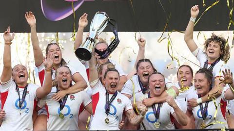 England's team celebrate winning the Six Nations