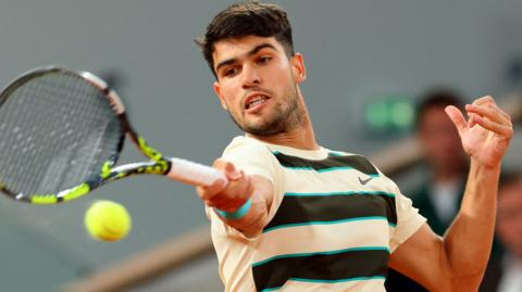 Carlos Alcaraz hits a forehand