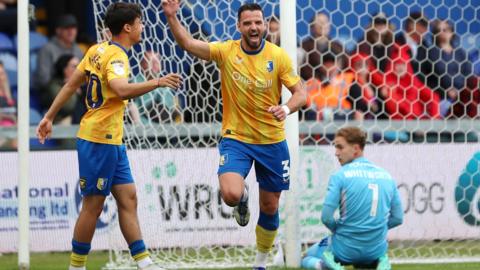 Mansfield celebrate a goal