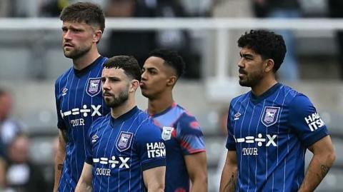 Ipswich players look crestfallen after the Tractor Boys' relegation was confirmed following defeat at Newcastle