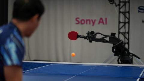 Sony AI autonomous robot Ace returns a shot back against its human opponent.