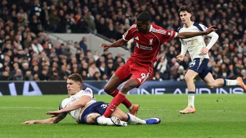 Tottenham defender Micky van de Ven tackles Liverpool's Alexander Isak as the Swede scores at Tottenham Hotspur Stadium
