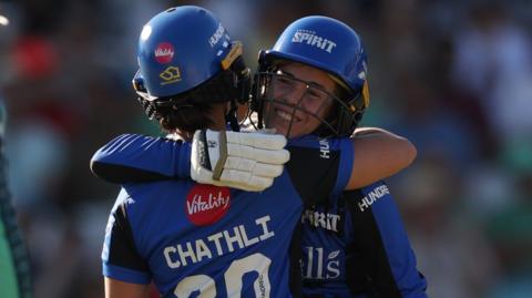 London Spirit batters Kira Chathli and Georgia Redmayne hug each other